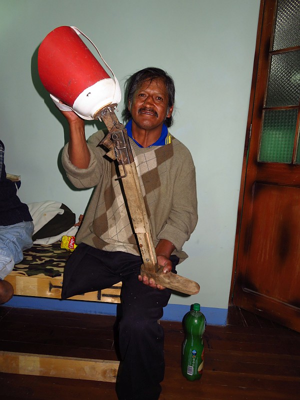 Javier holding his homemade prosthetic leg